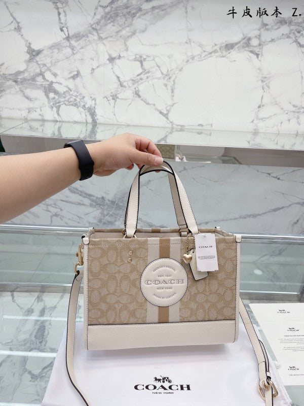 Coacch dempsey carryall signature jacquard stripe and patch with box