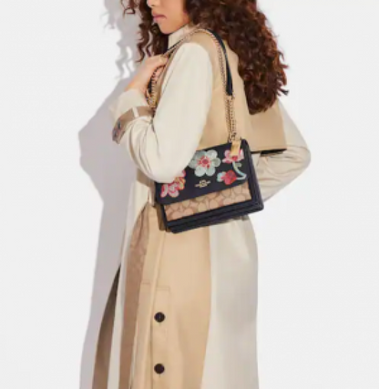 Klare Crossbody Bag In Signature Canvas With Floral Embroidery