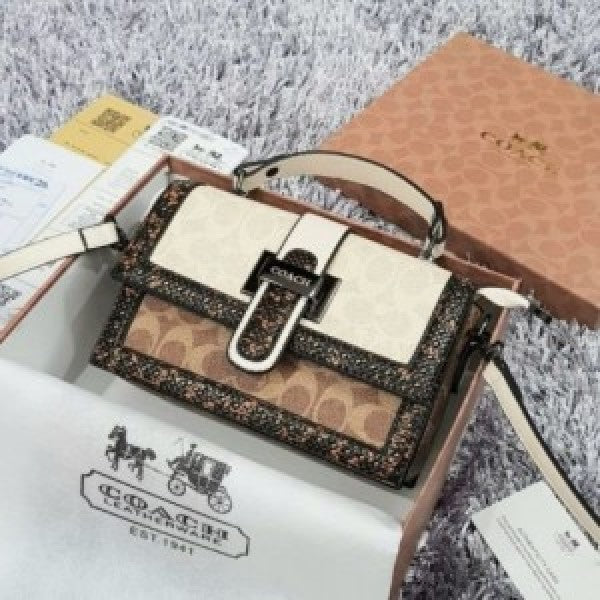 Coach studded flap sling bag with box