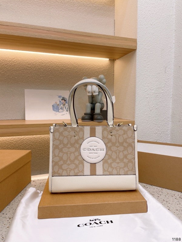 Coacch dempsey carryall signature jacquard stripe and patch with box
